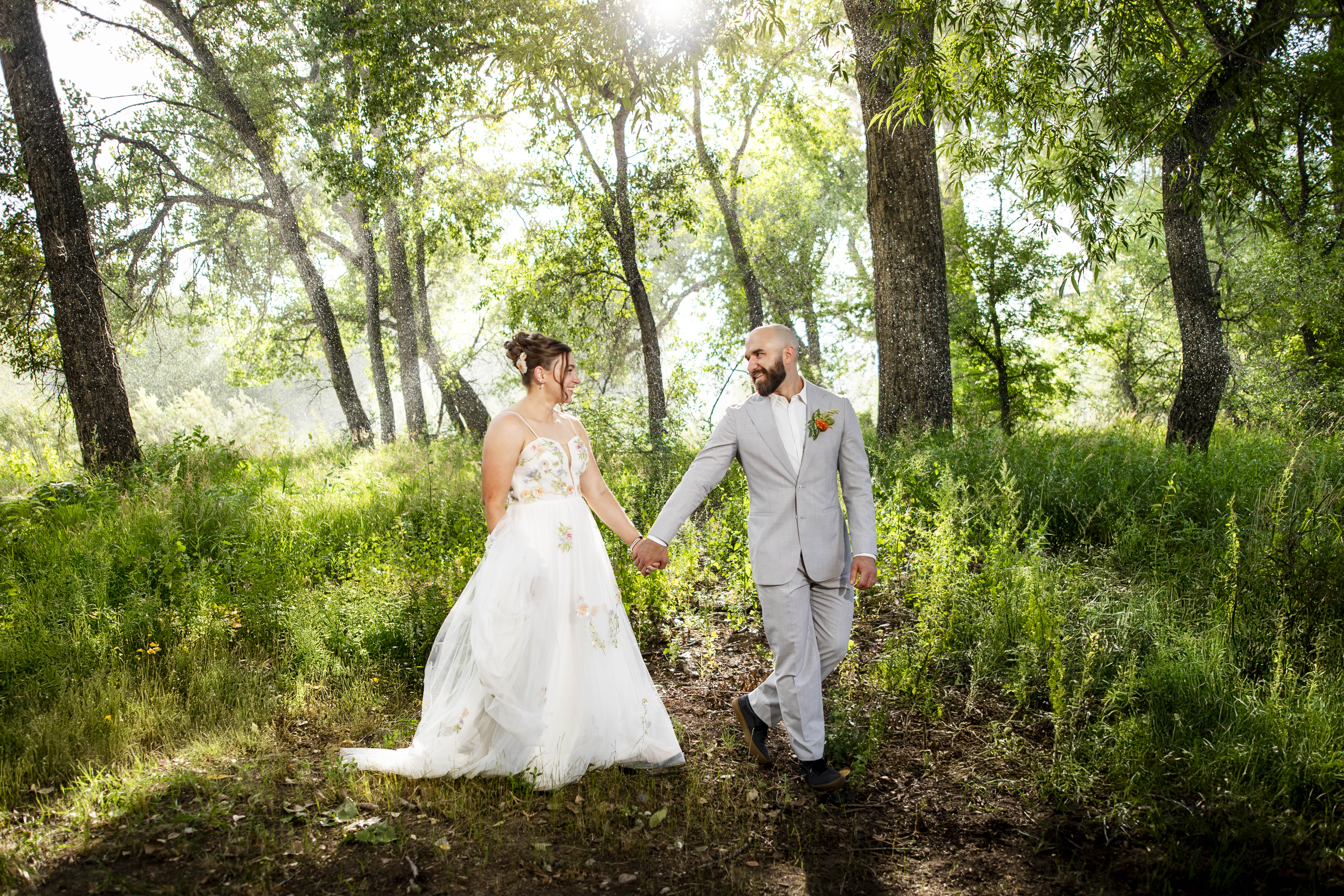 Rain-behind-bride-and-groom-at-nerdy-winery-loveland-colorado-wedding